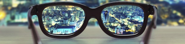 Night cityscape focused in glasses lenses
