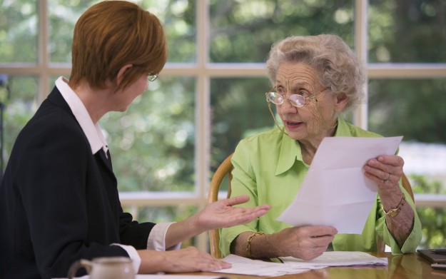 Senior woman meeting with agent