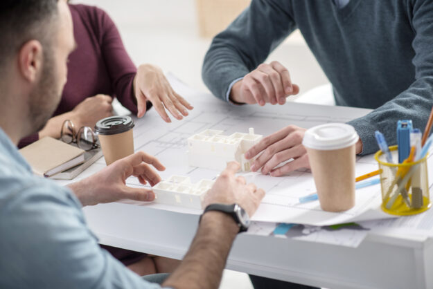 Successful colleagues working at the table