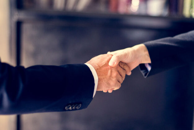 Close up of business people handshake